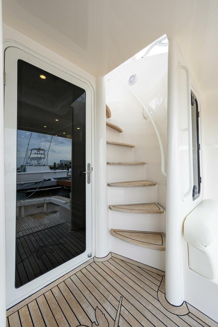 a white door with a glass door aboard GOIN DEEP Yacht for Sale