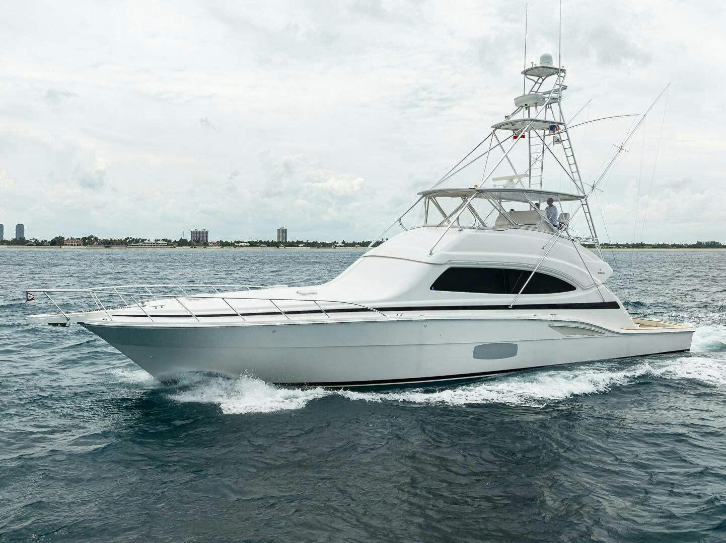 a white boat on the water aboard GOIN DEEP Yacht for Sale