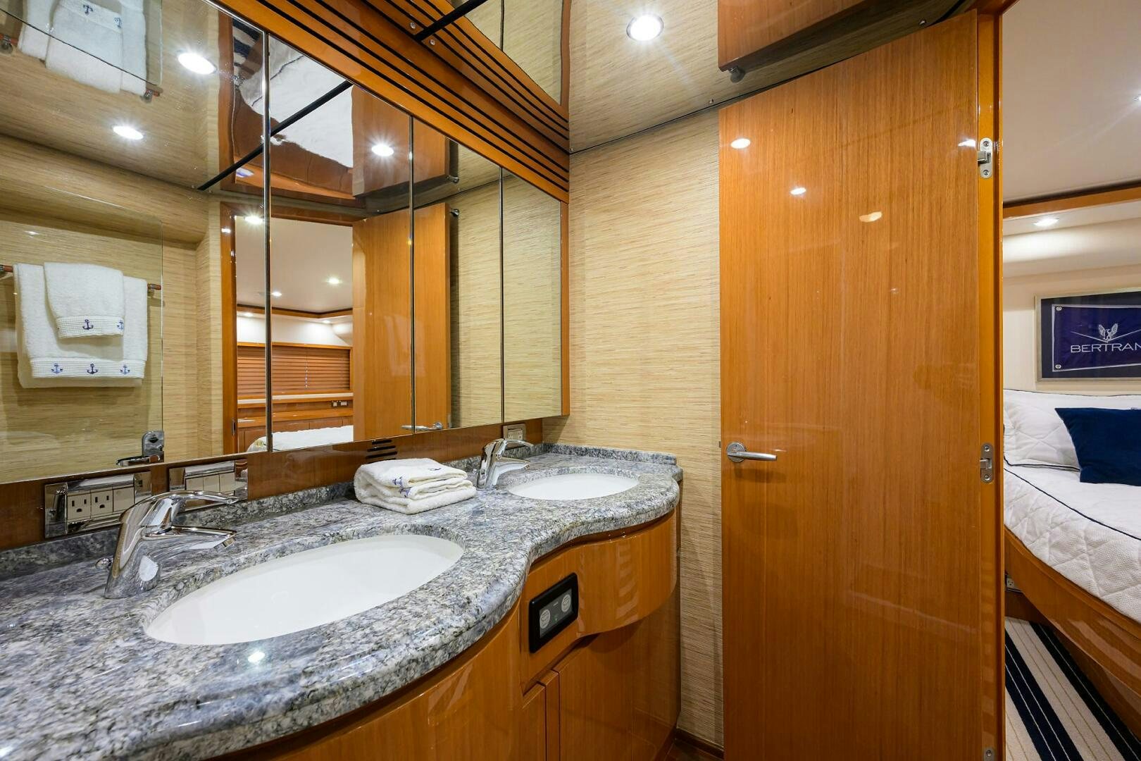 a bathroom with a countertop sink and a mirror aboard GOIN DEEP Yacht for Sale