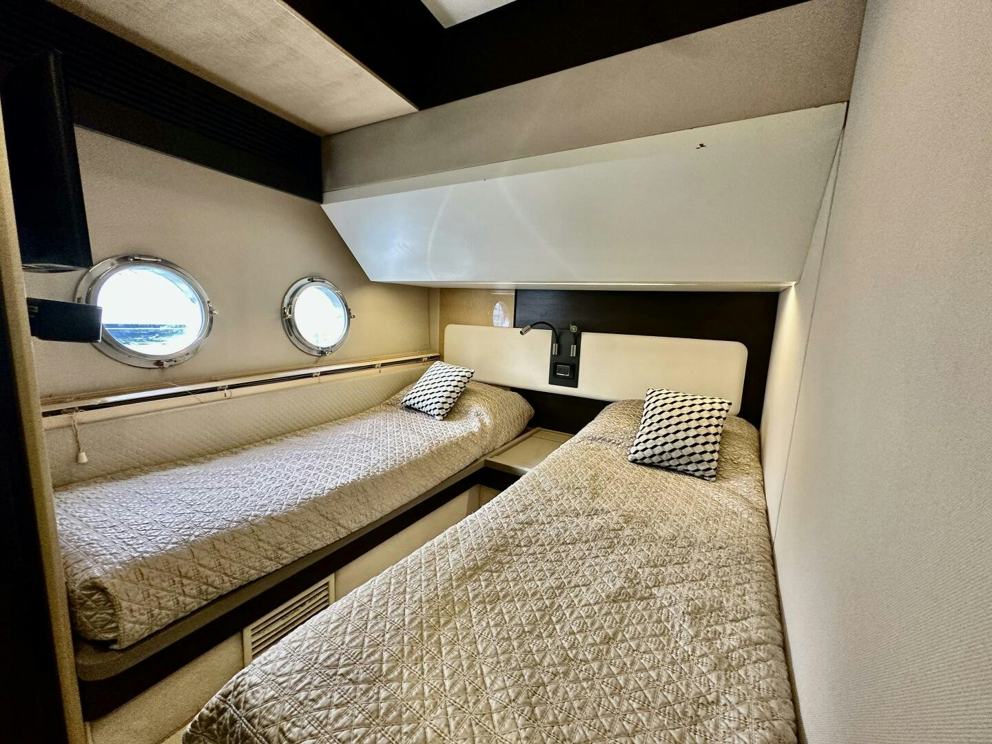 a bedroom with two beds aboard HOME WRECKER Yacht for Sale