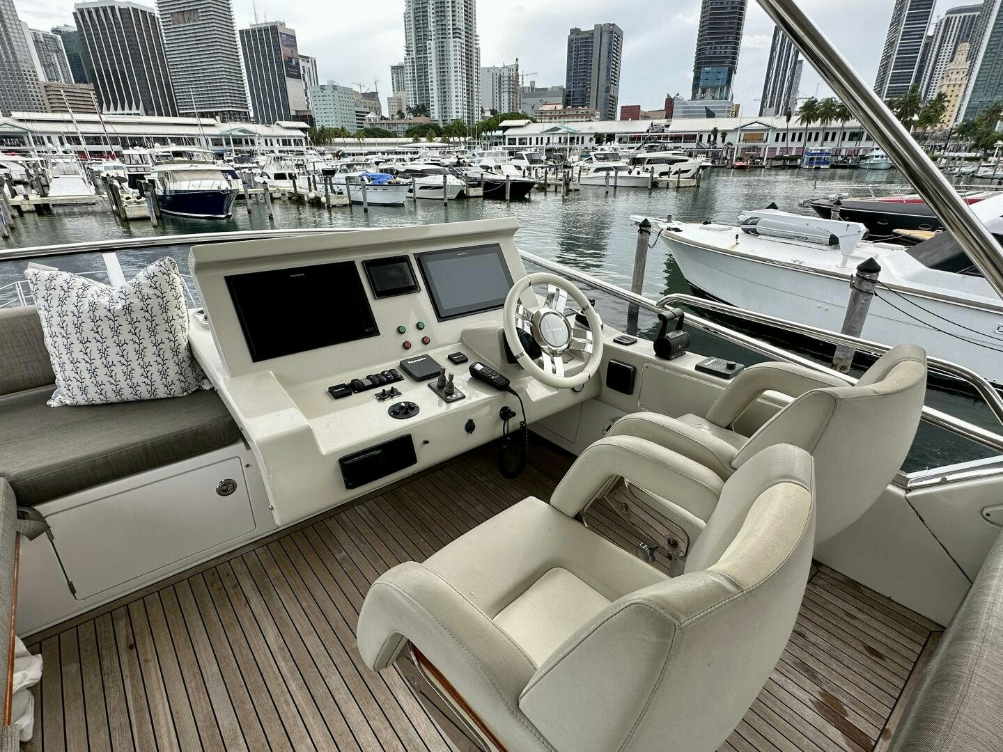 a deck with a view of a city and a large body of water aboard HOME WRECKER Yacht for Sale