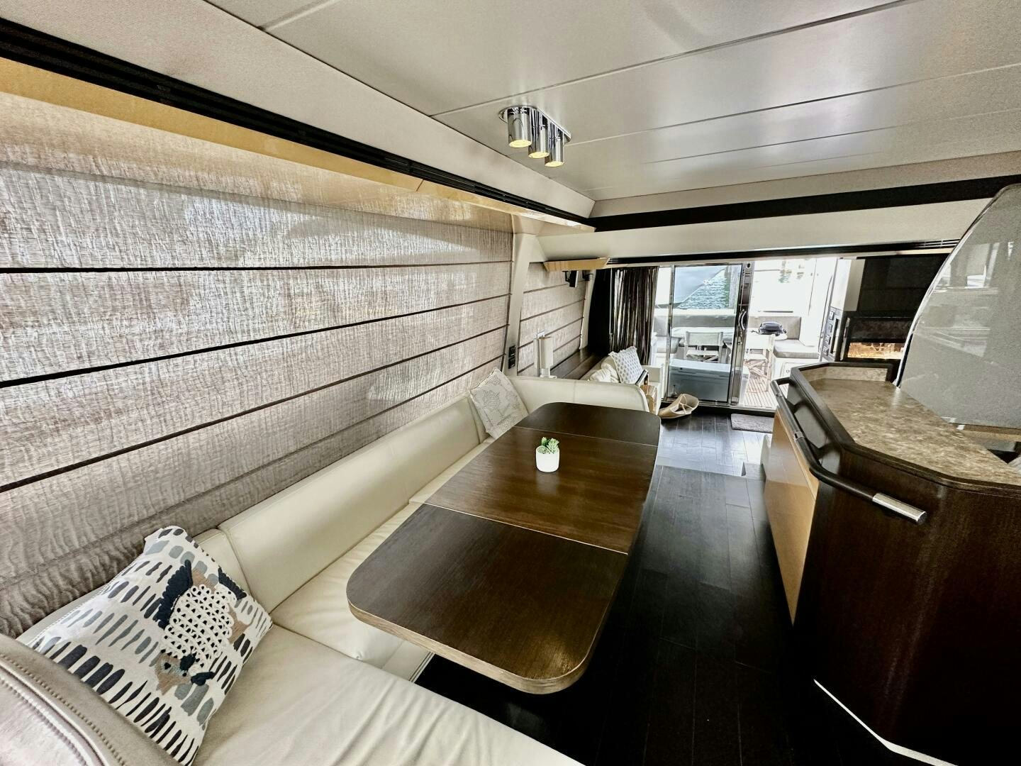 a room with a table and chairs aboard HOME WRECKER Yacht for Sale