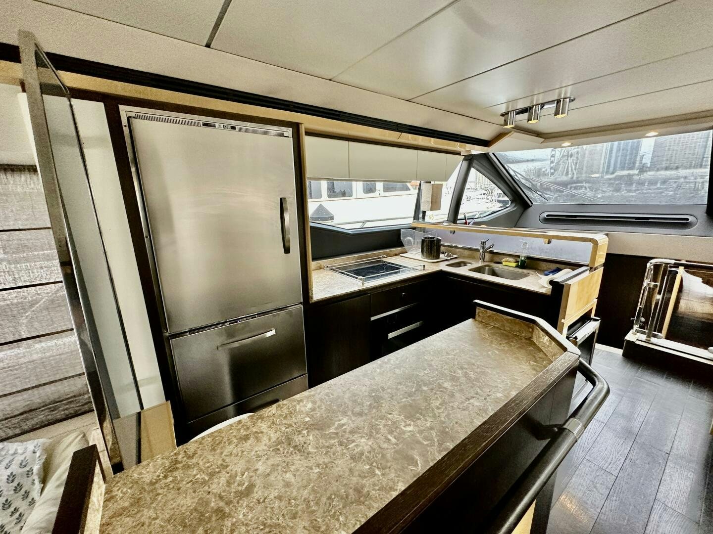 a kitchen with a large refrigerator aboard HOME WRECKER Yacht for Sale