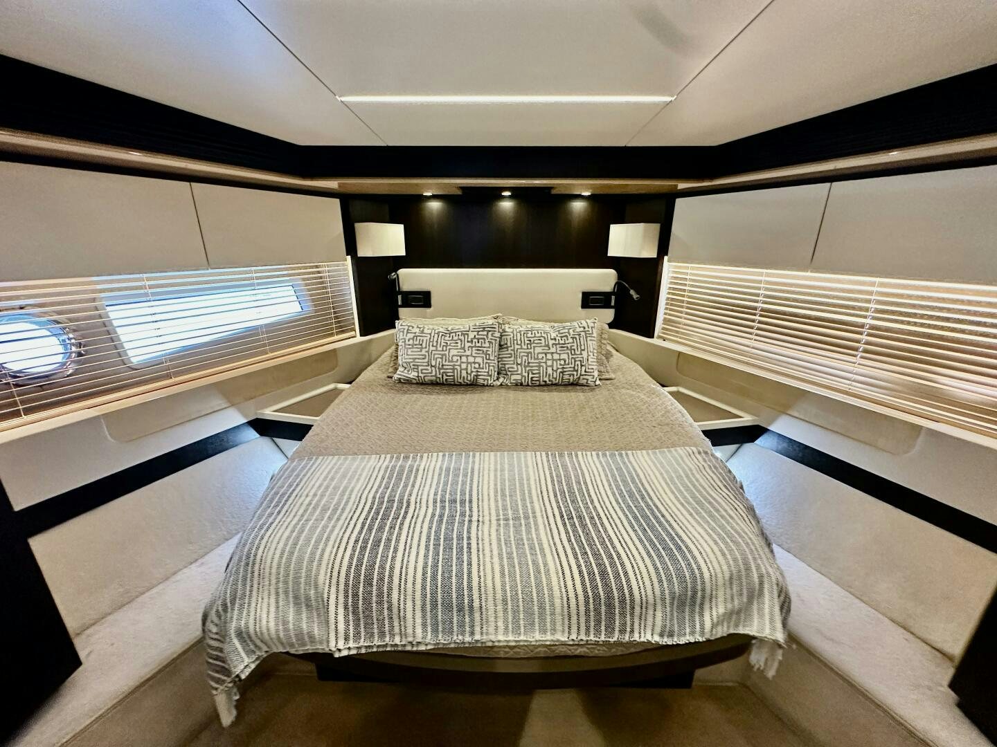 a room with a bed and a window aboard HOME WRECKER Yacht for Sale