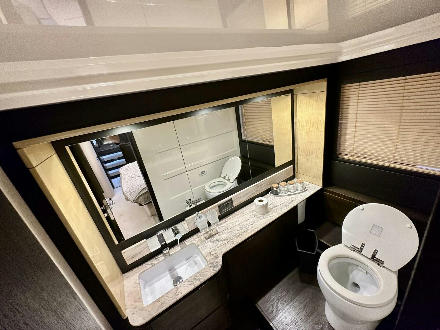 a bathroom with a large mirror aboard HOME WRECKER Yacht for Sale