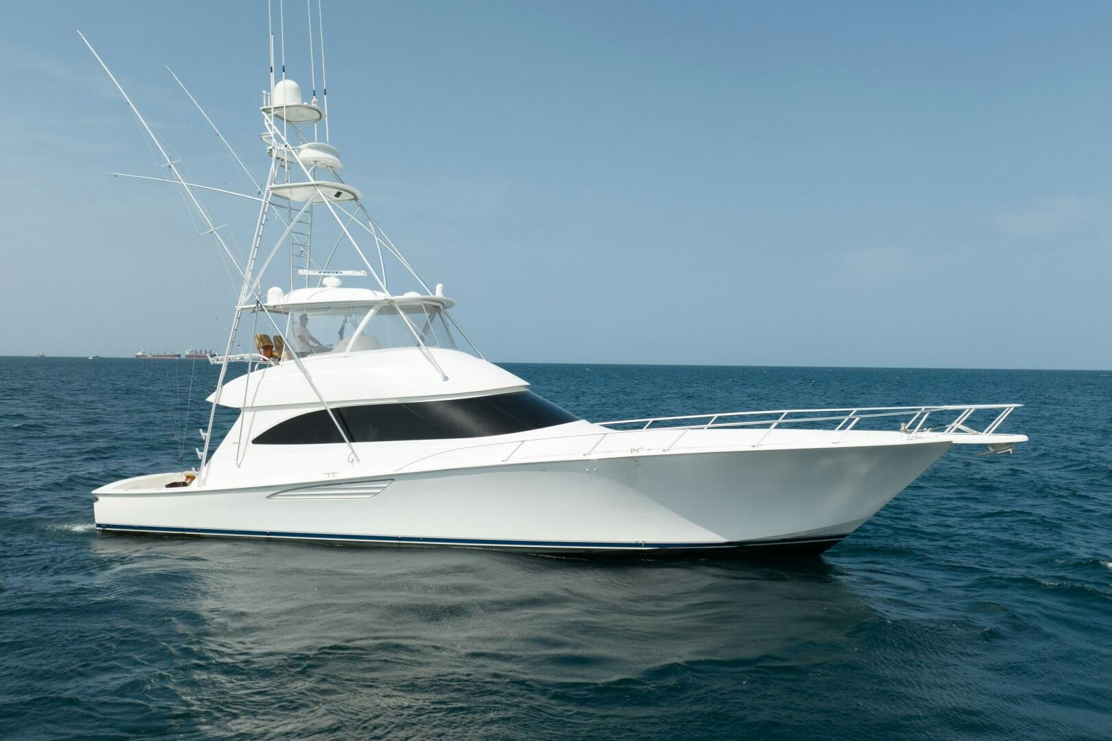 a white boat in the water aboard NO COLLARS Yacht for Sale