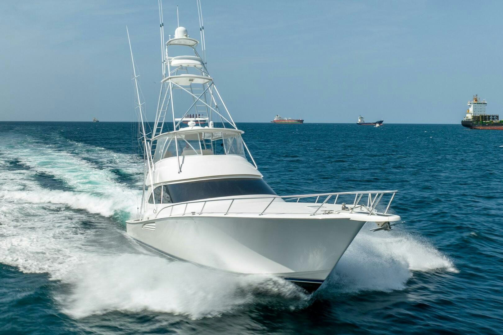 a white boat in the water aboard NO COLLARS Yacht for Sale