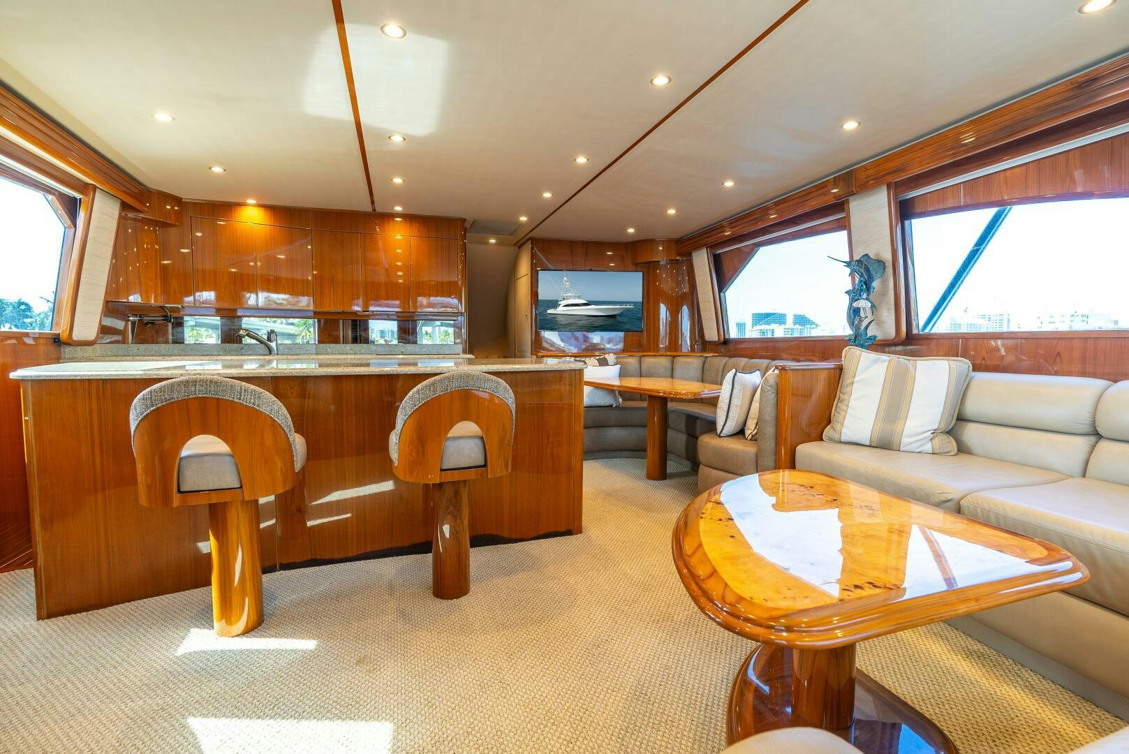 a large room with a couch and a table aboard NO COLLARS Yacht for Sale