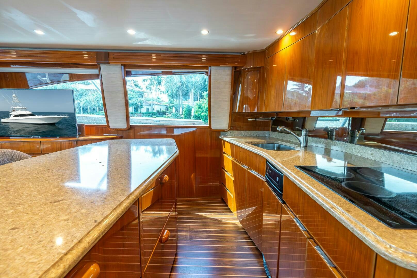 a kitchen with wooden cabinets aboard NO COLLARS Yacht for Sale