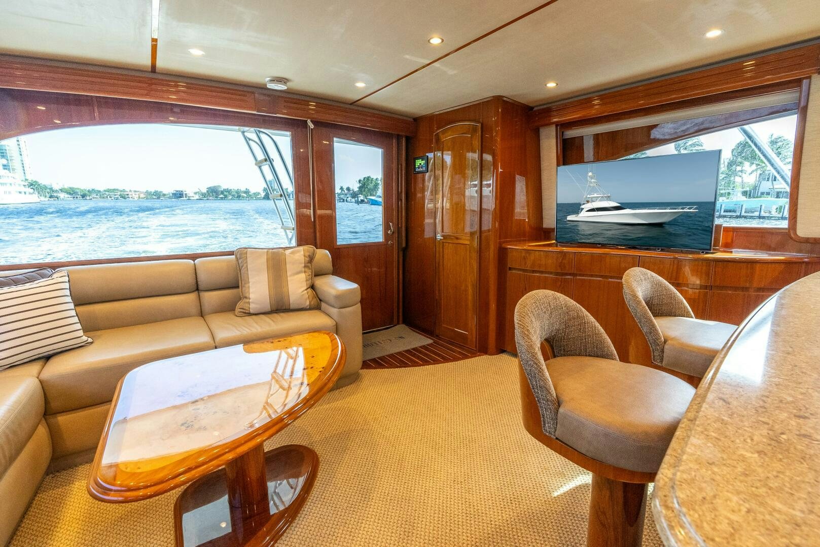 a living room with a large window aboard NO COLLARS Yacht for Sale