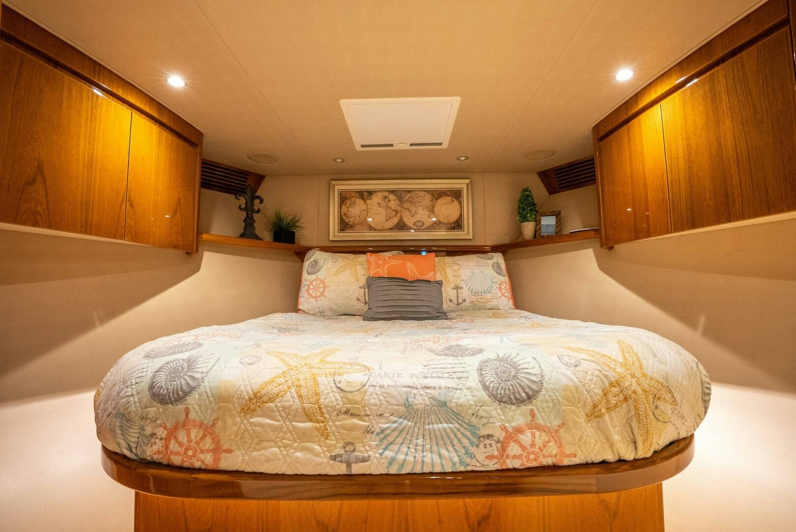 a bed with a white sheet and pillows aboard NO COLLARS Yacht for Sale