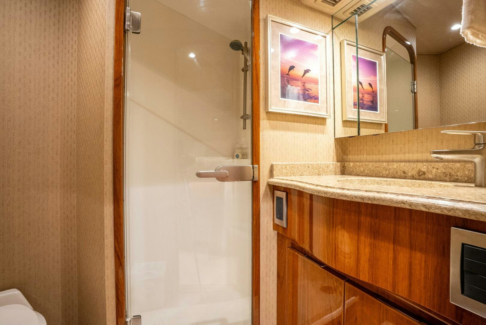 a bathroom with a shower and sink aboard NO COLLARS Yacht for Sale
