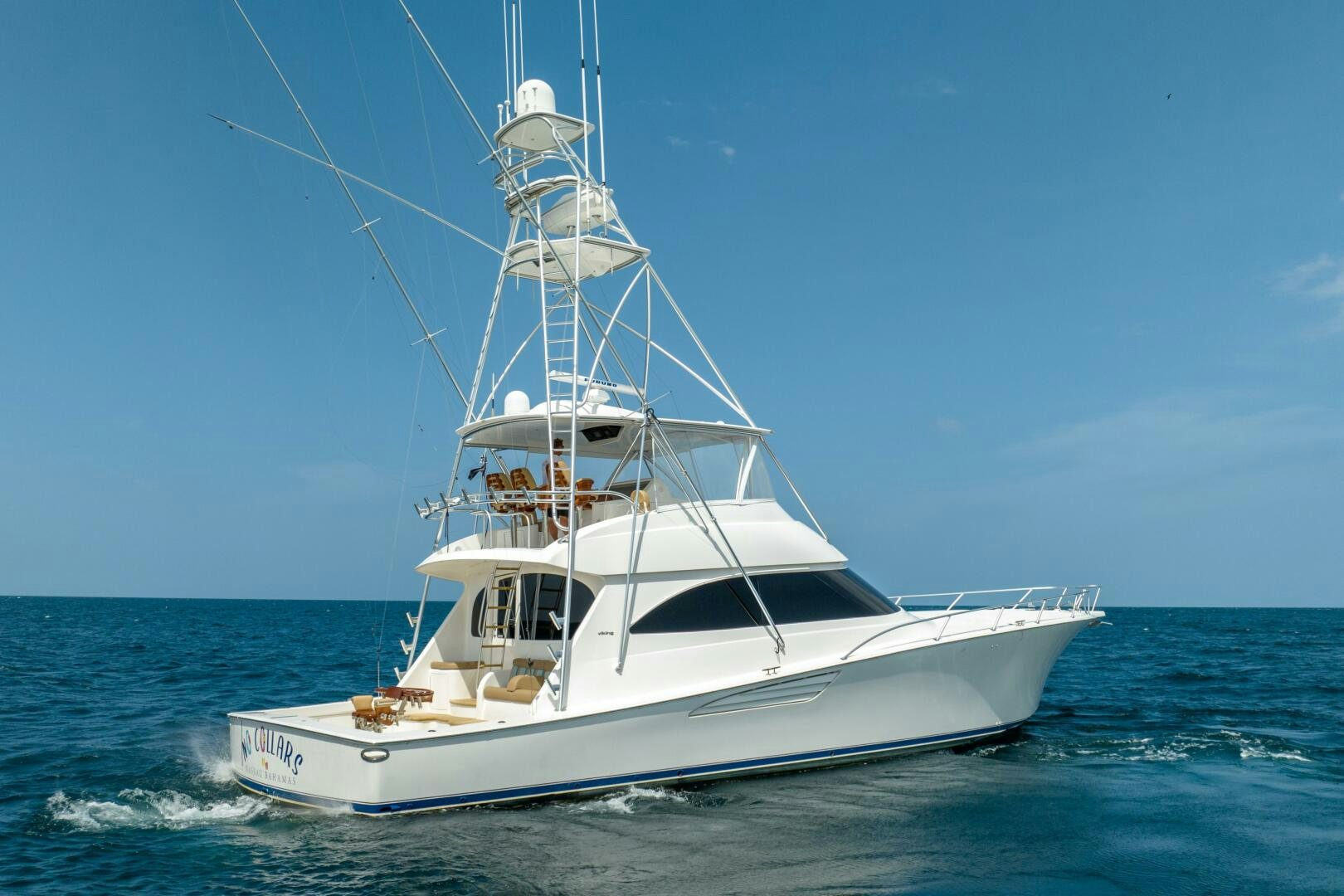 a white boat in the water aboard NO COLLARS Yacht for Sale