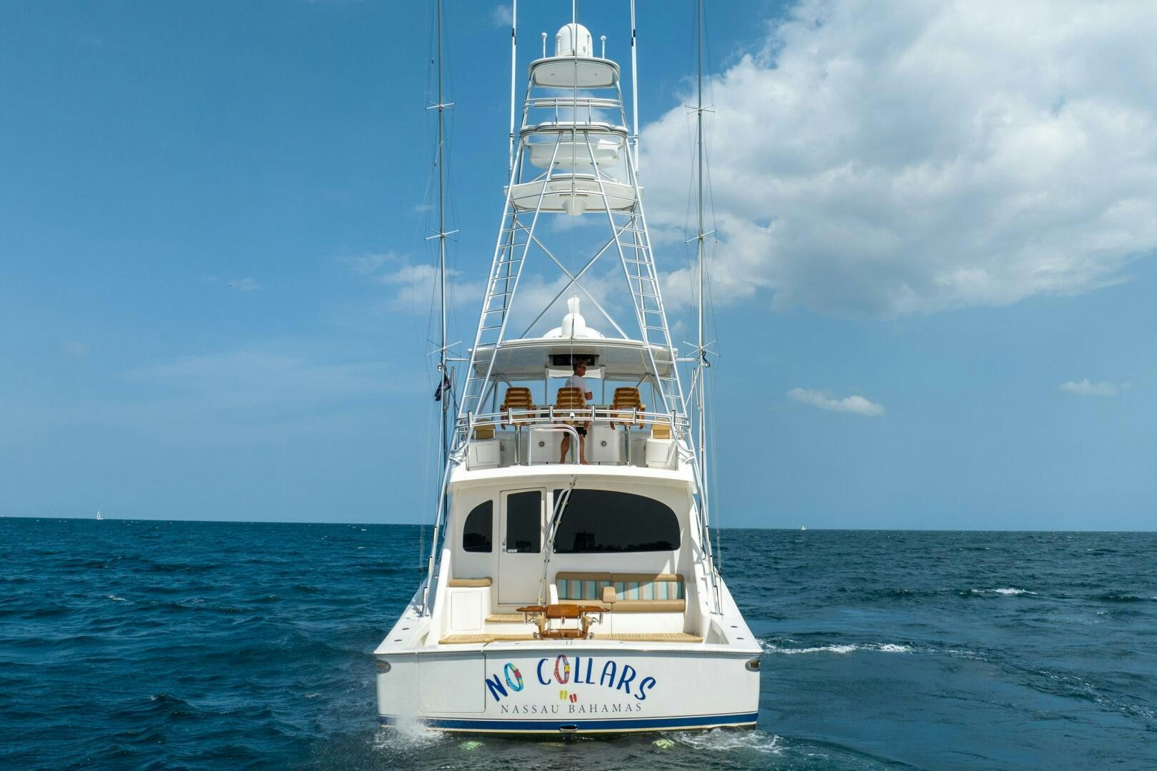 a white boat in the water aboard NO COLLARS Yacht for Sale