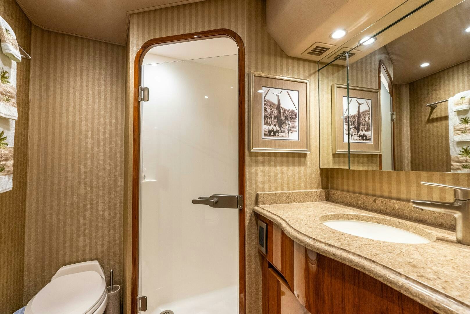 a bathroom with a sink and a shower aboard NO COLLARS Yacht for Sale