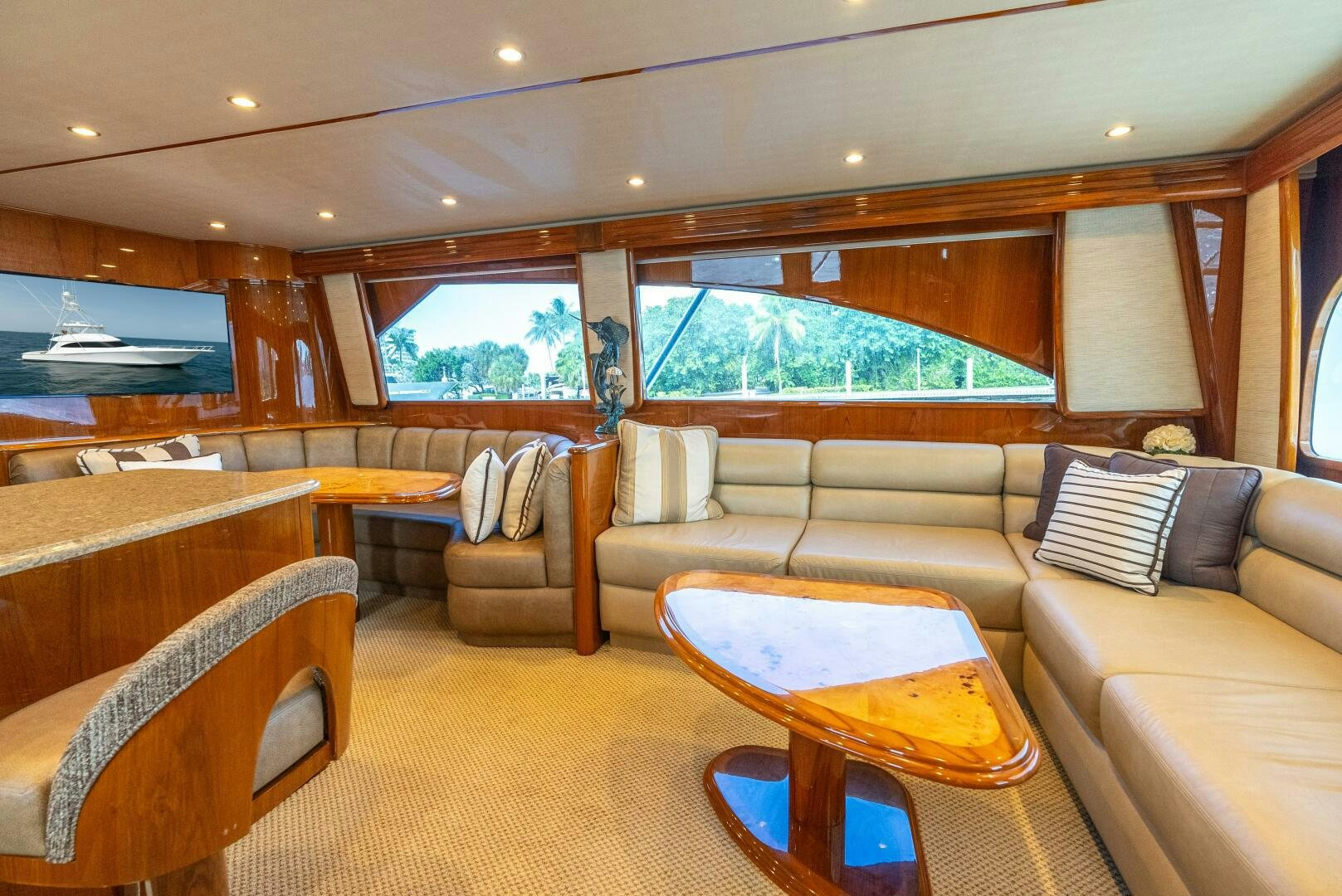 a large living room with a large window aboard NO COLLARS Yacht for Sale