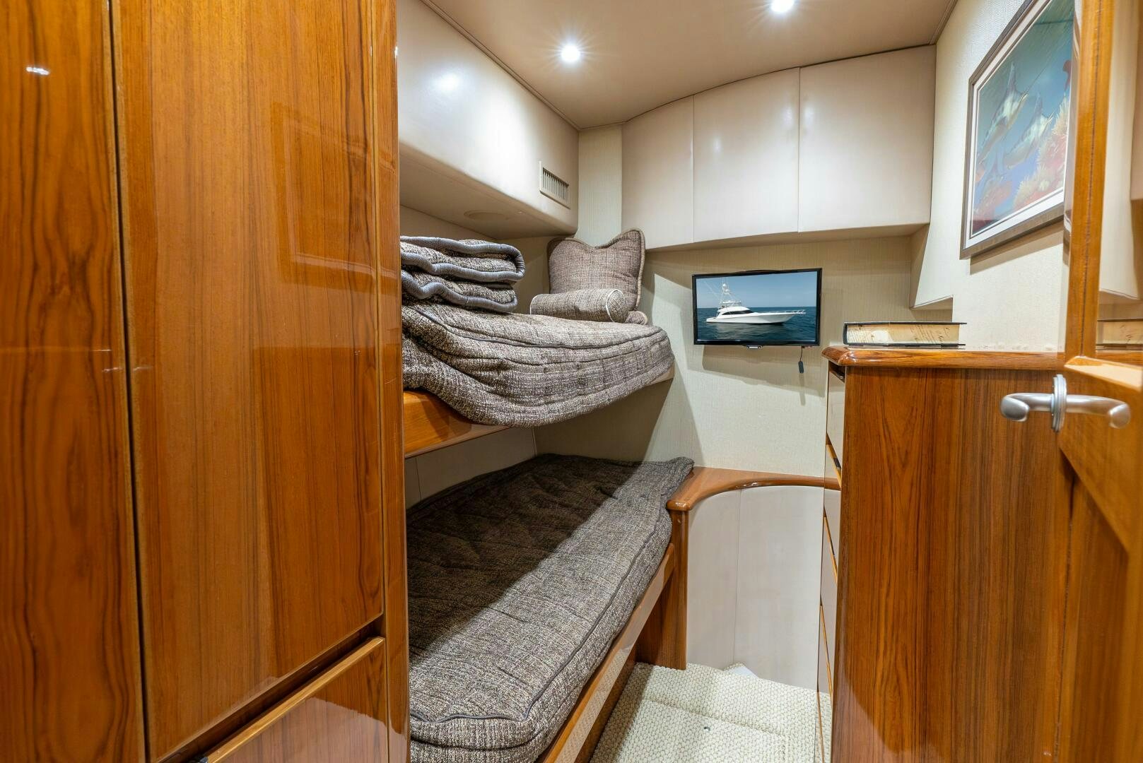 a room with a bed and a closet aboard NO COLLARS Yacht for Sale