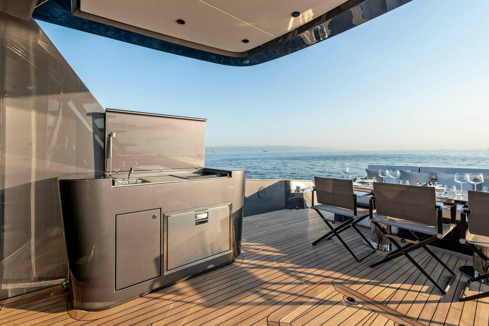 a room with a large balcony overlooking the ocean aboard SUNYA Yacht for Sale