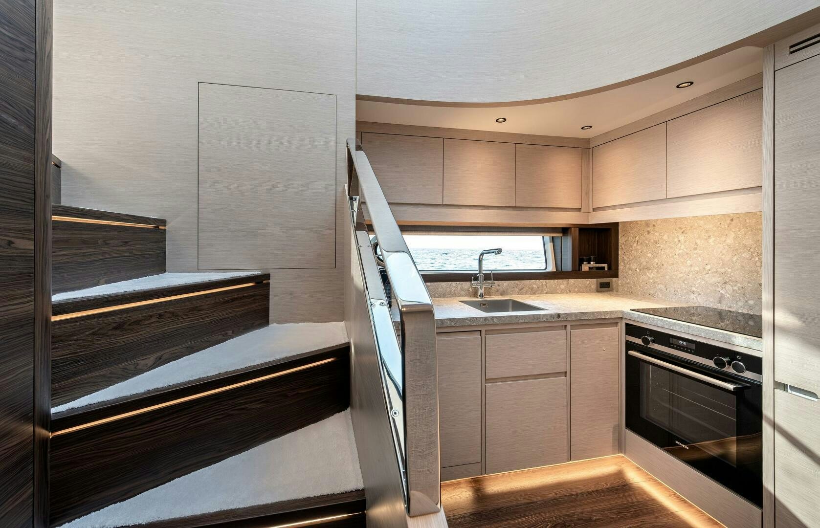 a kitchen with a stove and sink aboard SUNYA Yacht for Sale