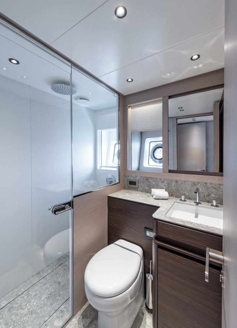 a bathroom with a glass shower aboard SUNYA Yacht for Sale