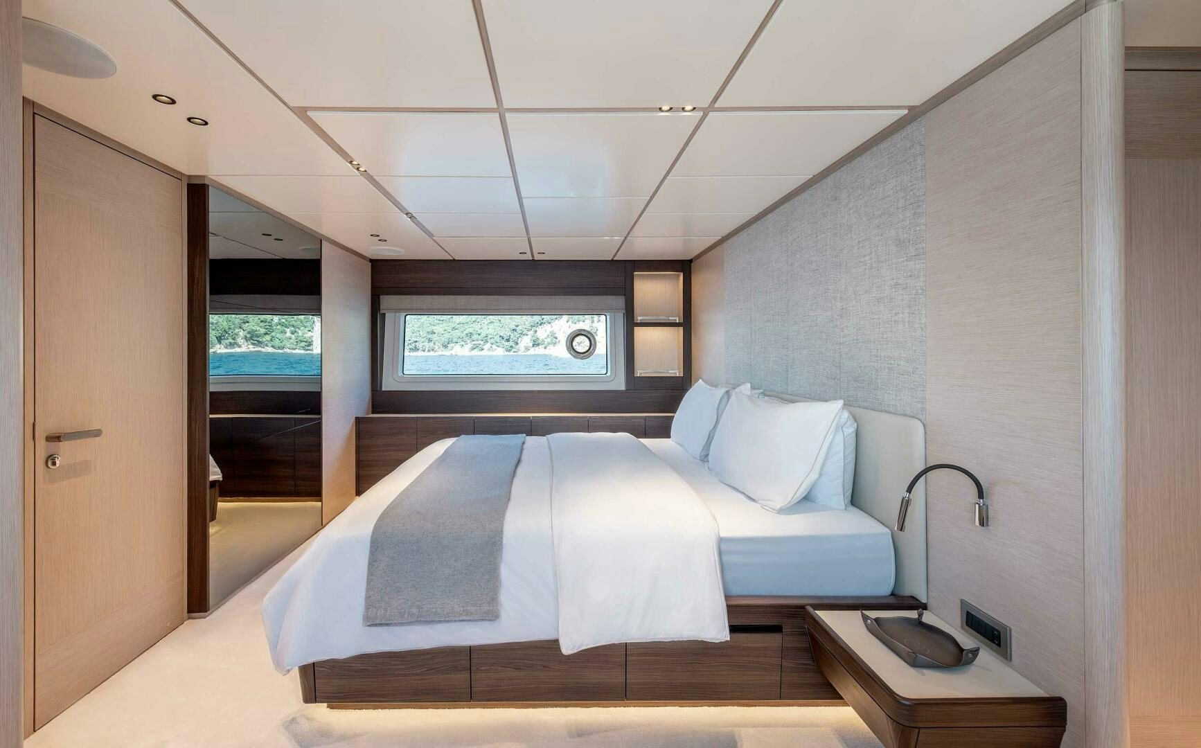 a bedroom with a bed aboard SUNYA Yacht for Sale
