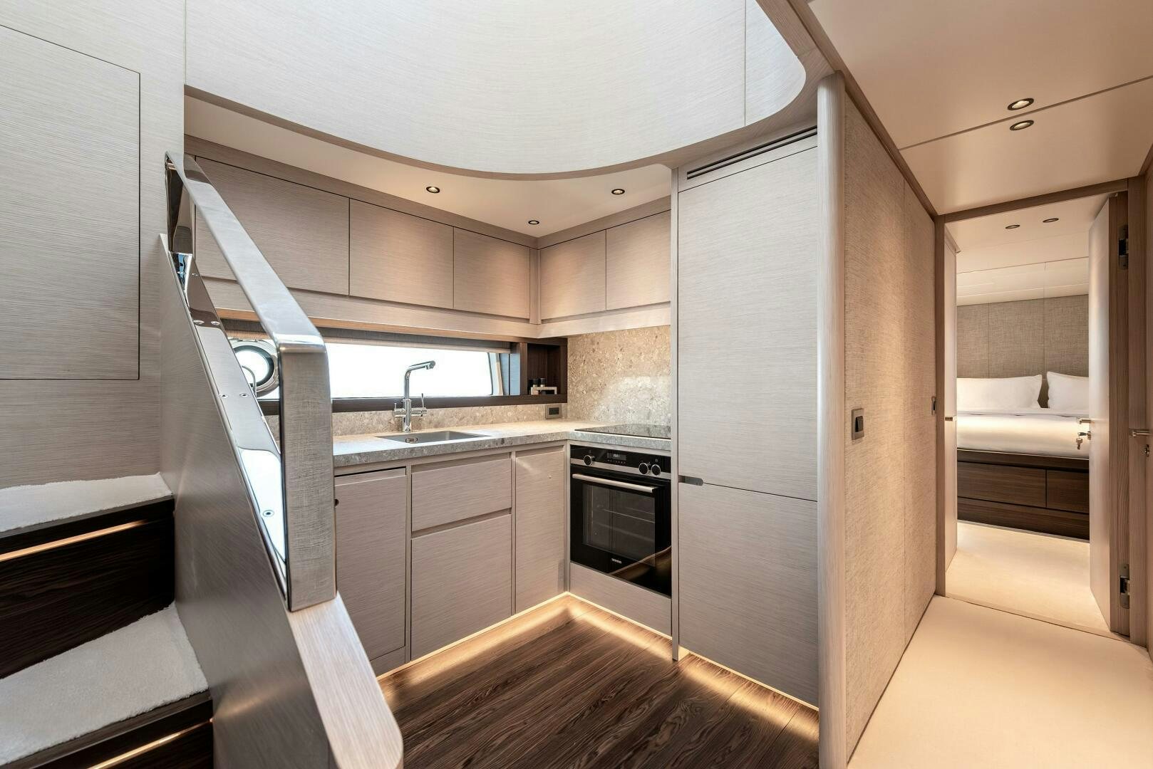 a kitchen with white cabinets aboard SUNYA Yacht for Sale