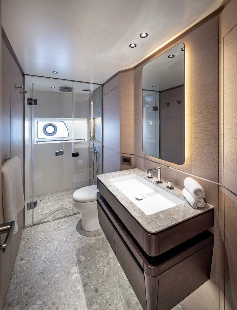 a bathroom with a sink and a mirror aboard SUNYA Yacht for Sale