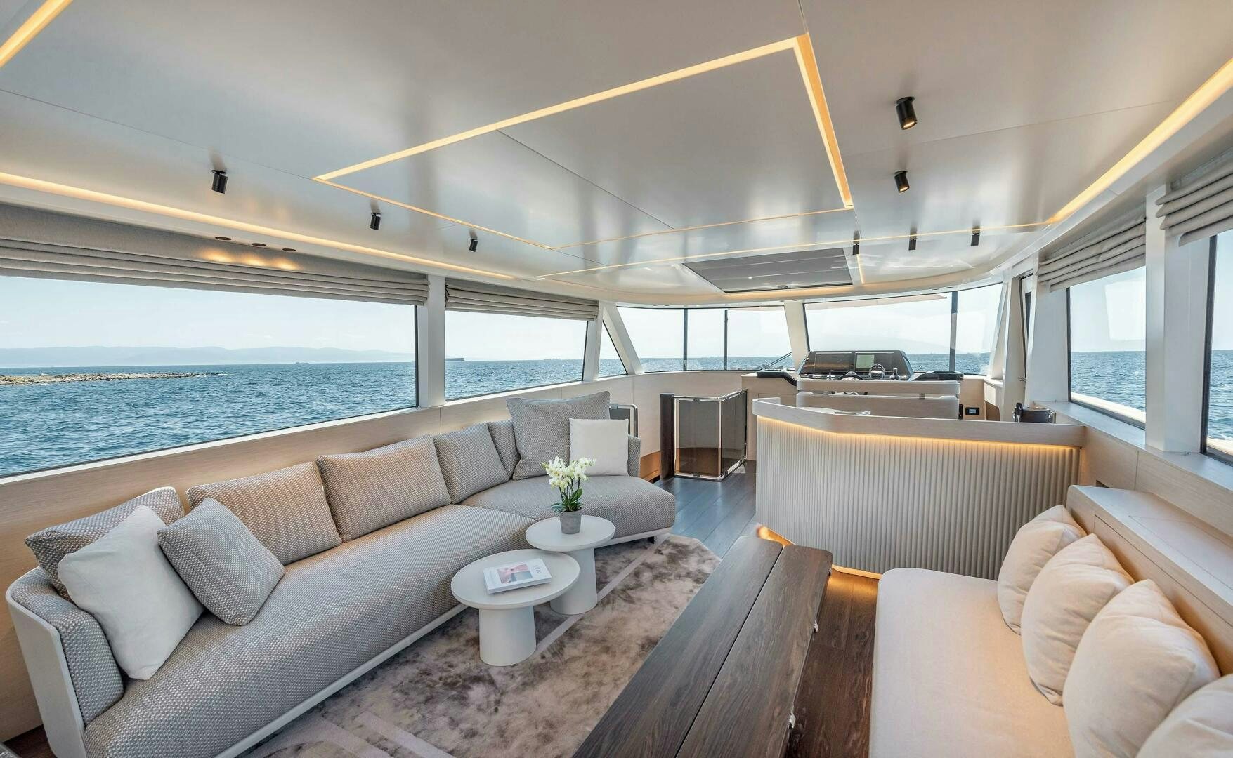 a living room with a large window overlooking the ocean aboard SUNYA Yacht for Sale
