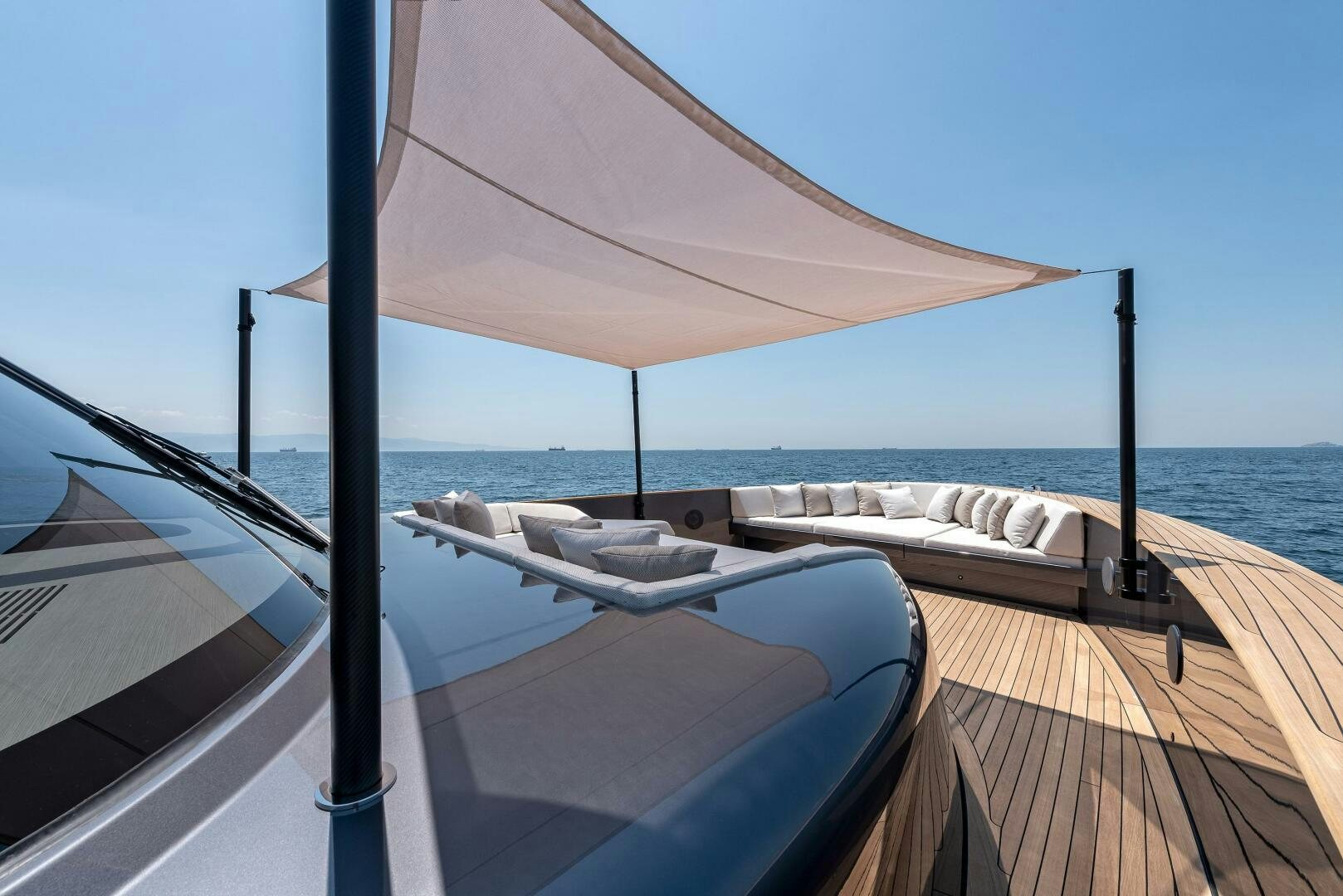 a deck with a view of the ocean and the ocean aboard SUNYA Yacht for Sale