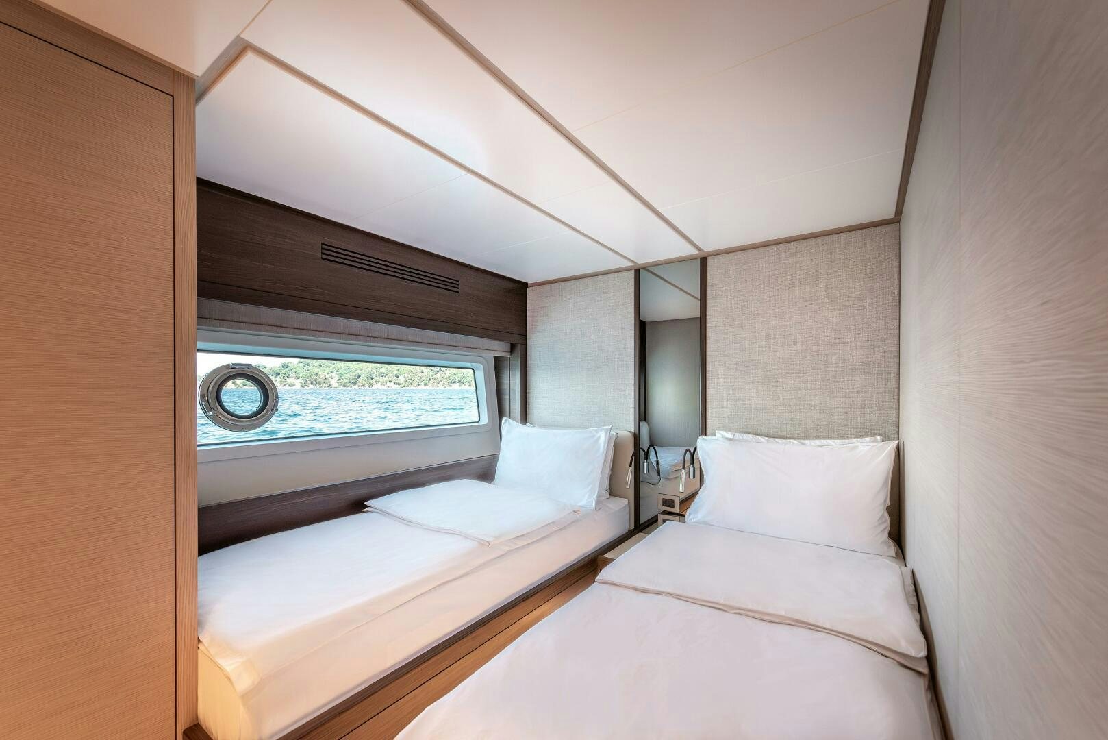 a room with two beds aboard SUNYA Yacht for Sale