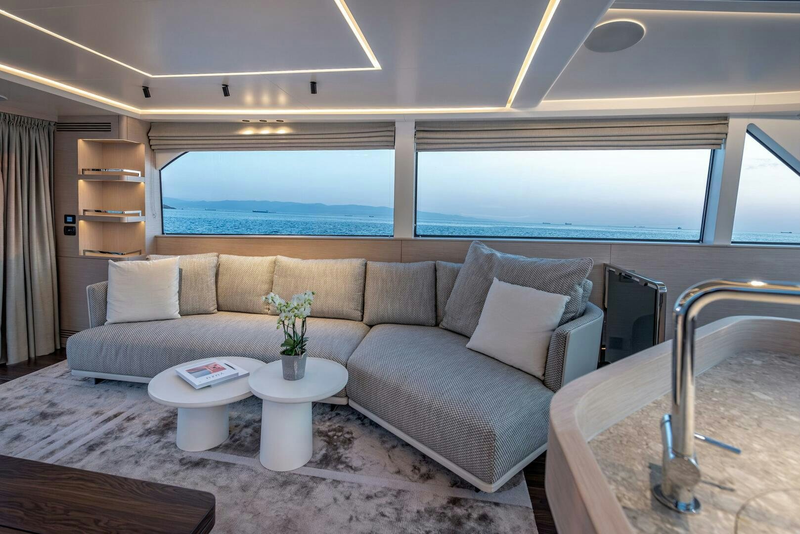 a living room with a large window aboard SUNYA Yacht for Sale