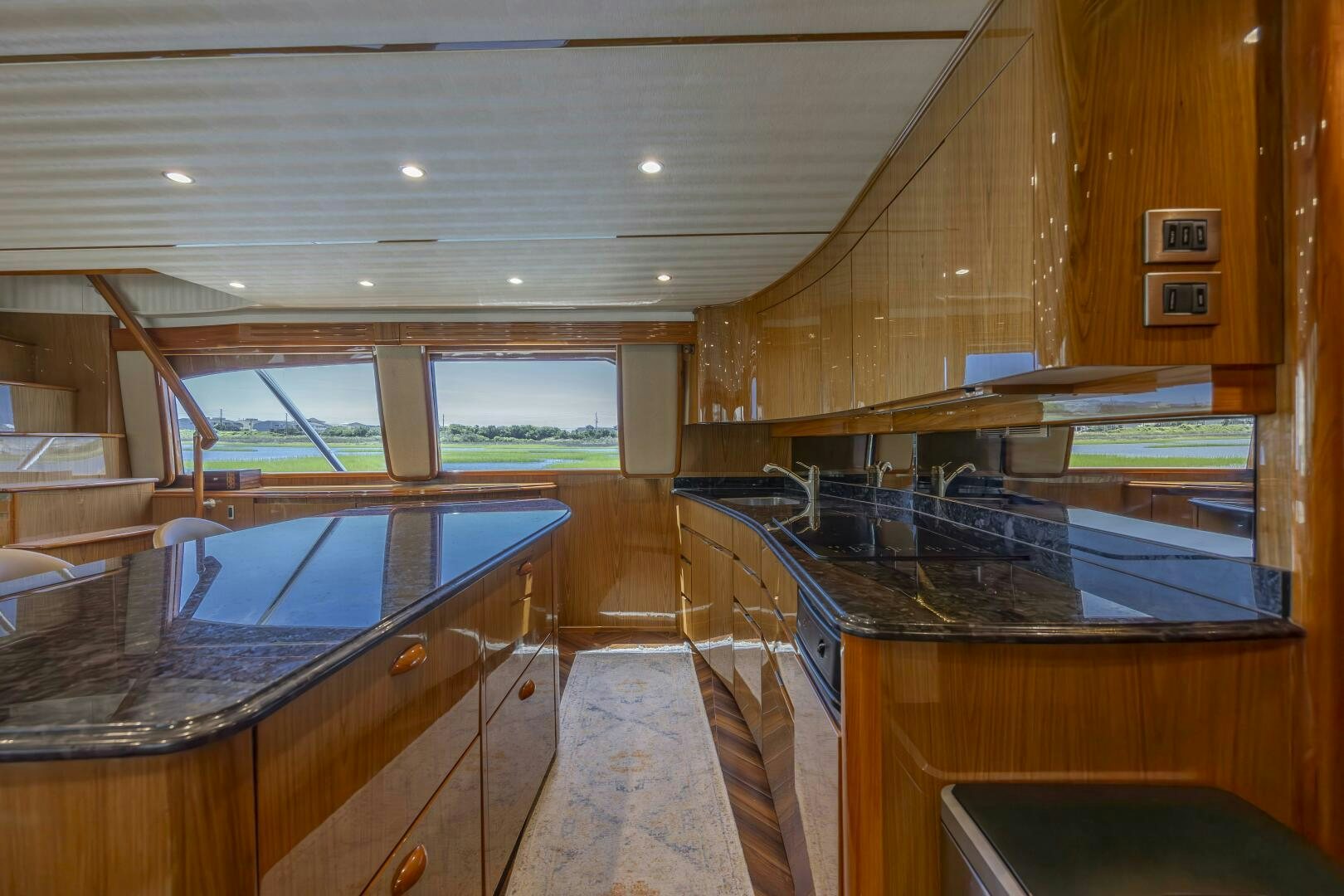 a kitchen with wooden cabinets aboard SAVING GRACE Yacht for Sale