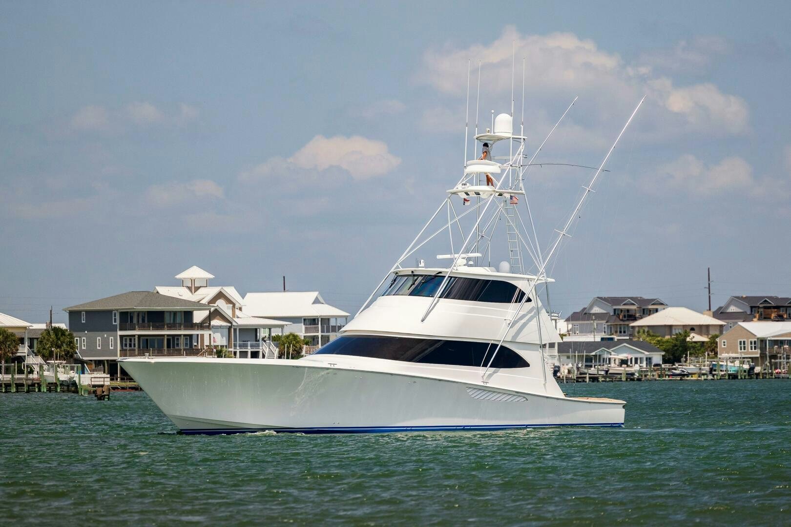 a white boat in the water aboard SAVING GRACE Yacht for Sale