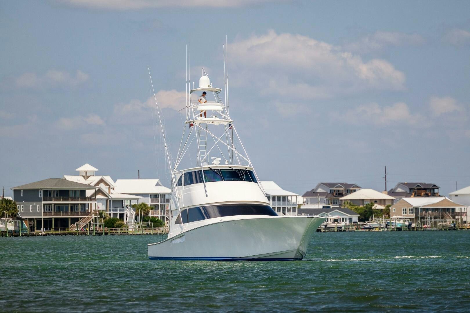 a white boat in the water aboard SAVING GRACE Yacht for Sale