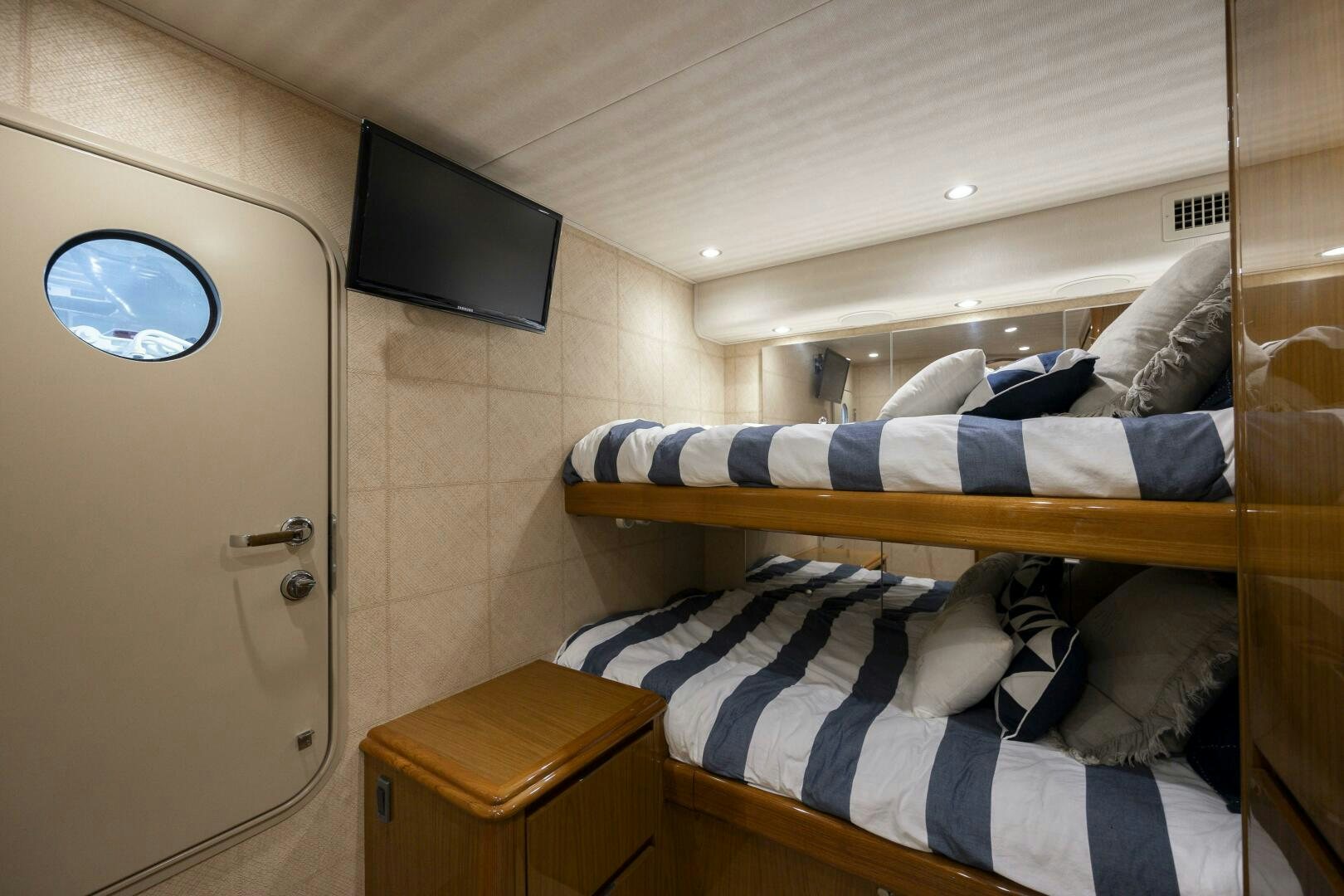 a room with a bed and a tv aboard SAVING GRACE Yacht for Sale