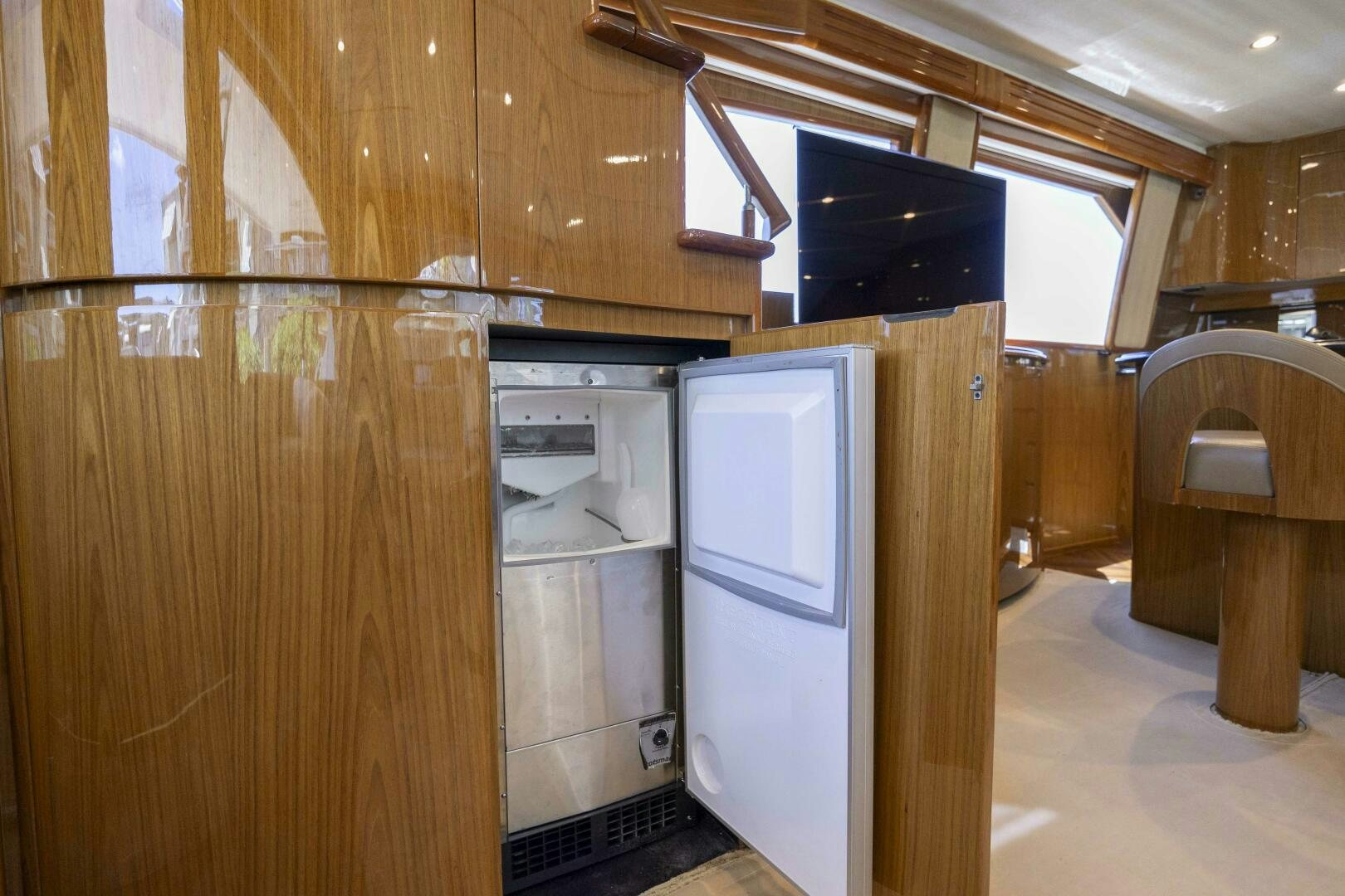 a kitchen with wooden cabinets aboard SAVING GRACE Yacht for Sale