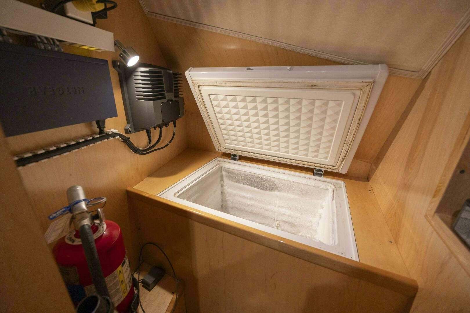 a white computer tower aboard SAVING GRACE Yacht for Sale