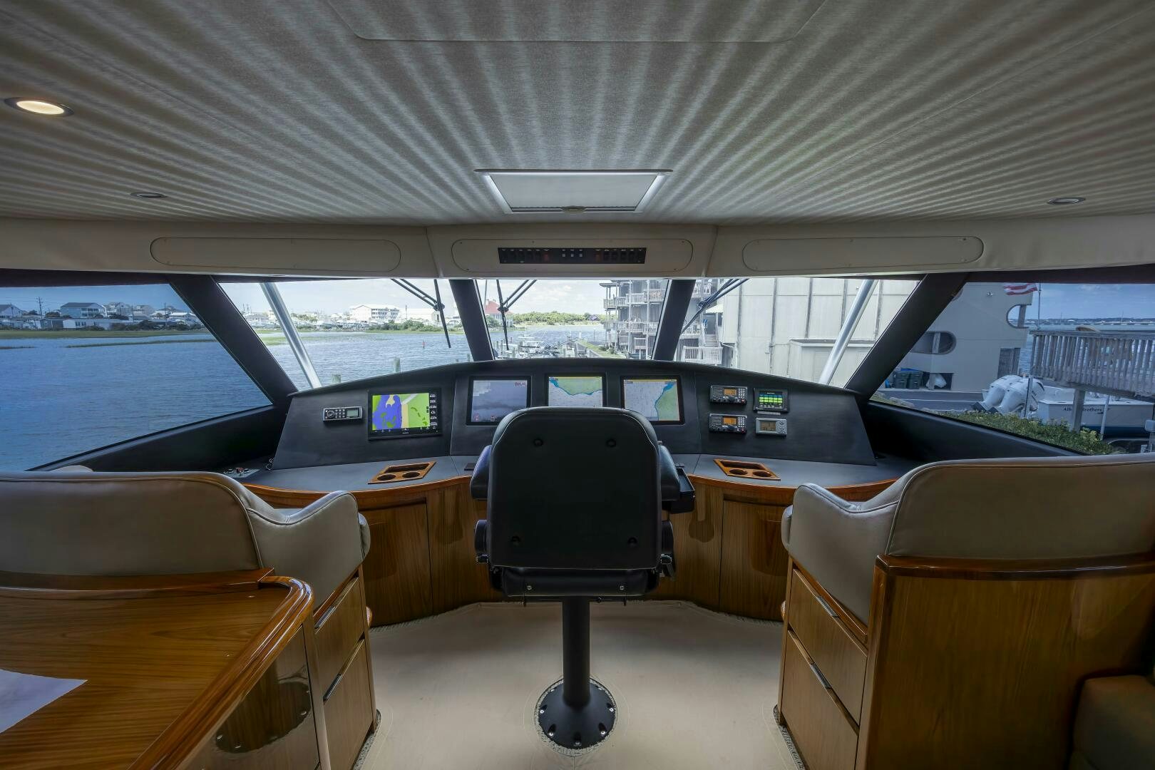 a room with a desk and chairs aboard SAVING GRACE Yacht for Sale