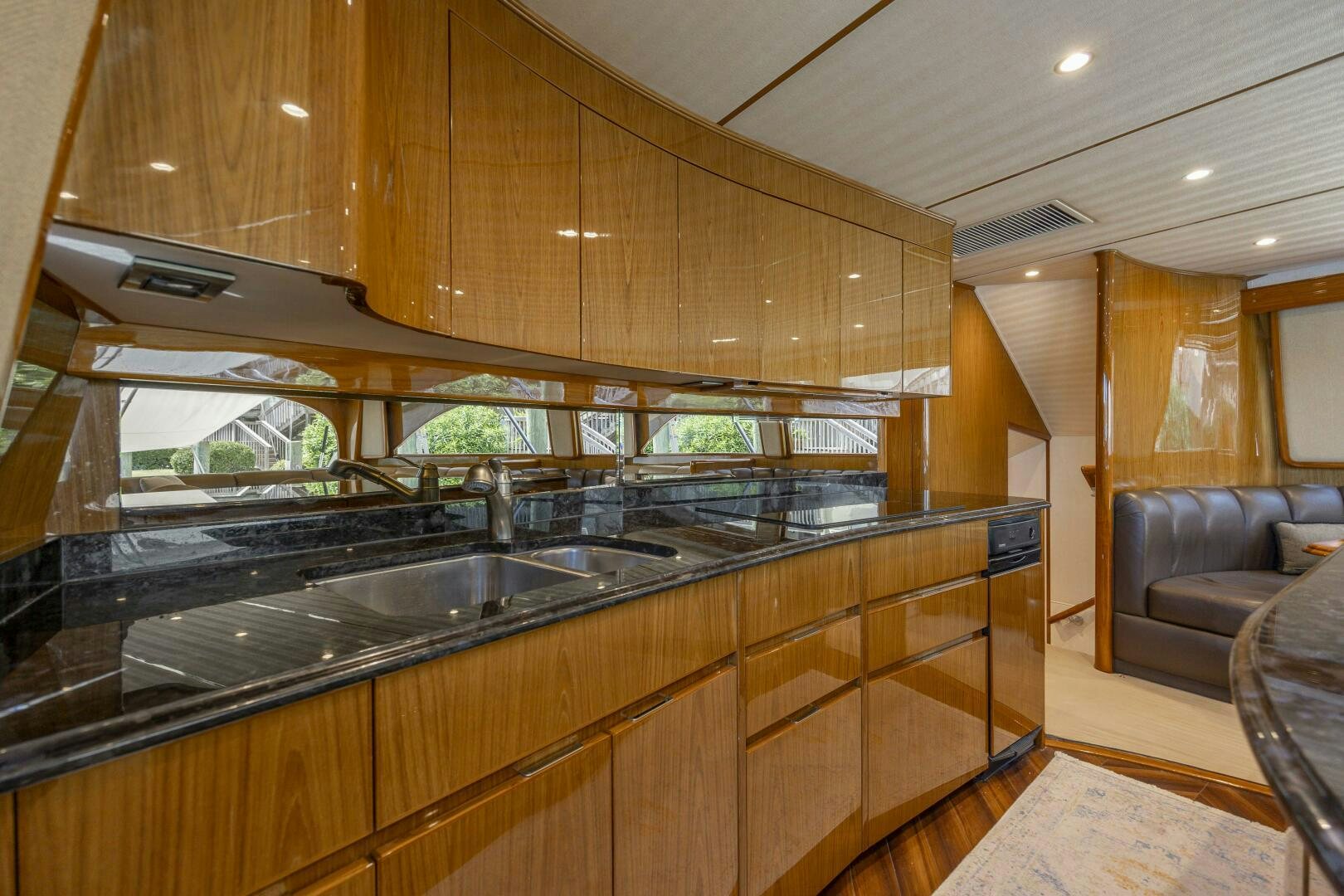 a kitchen with wooden cabinets aboard SAVING GRACE Yacht for Sale