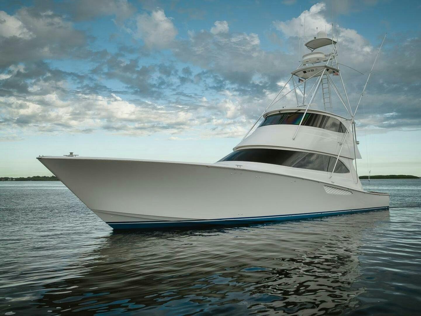 a white boat on the water aboard SAVING GRACE Yacht for Sale