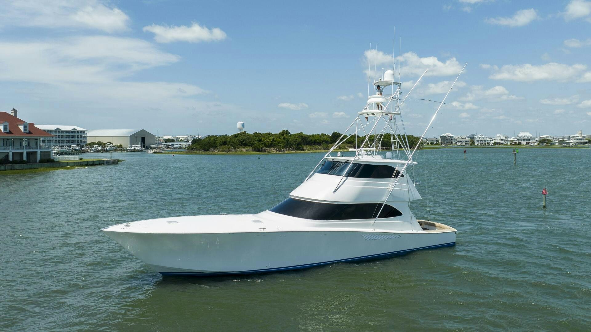 a white boat in the water aboard SAVING GRACE Yacht for Sale