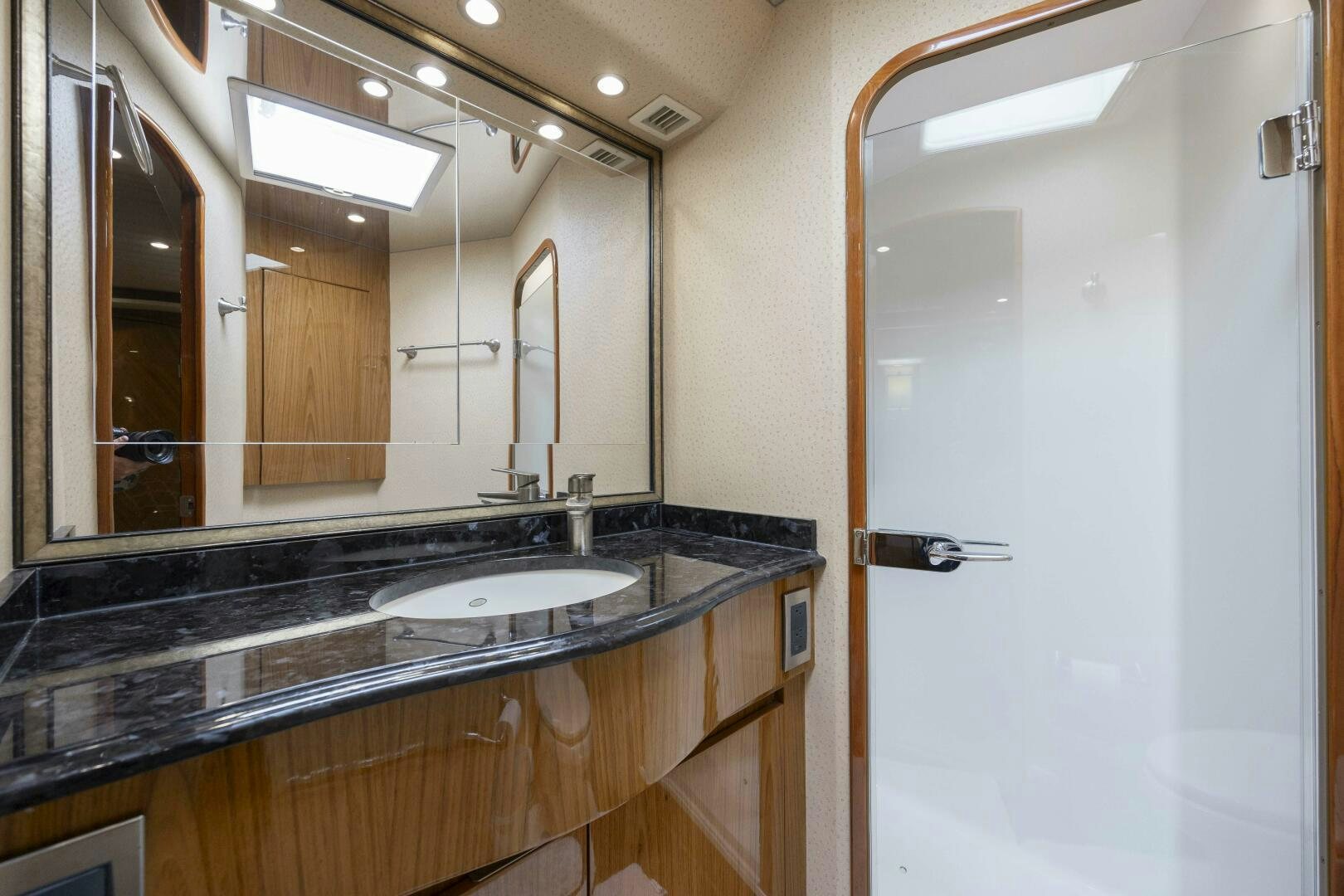 a bathroom with a large mirror aboard SAVING GRACE Yacht for Sale