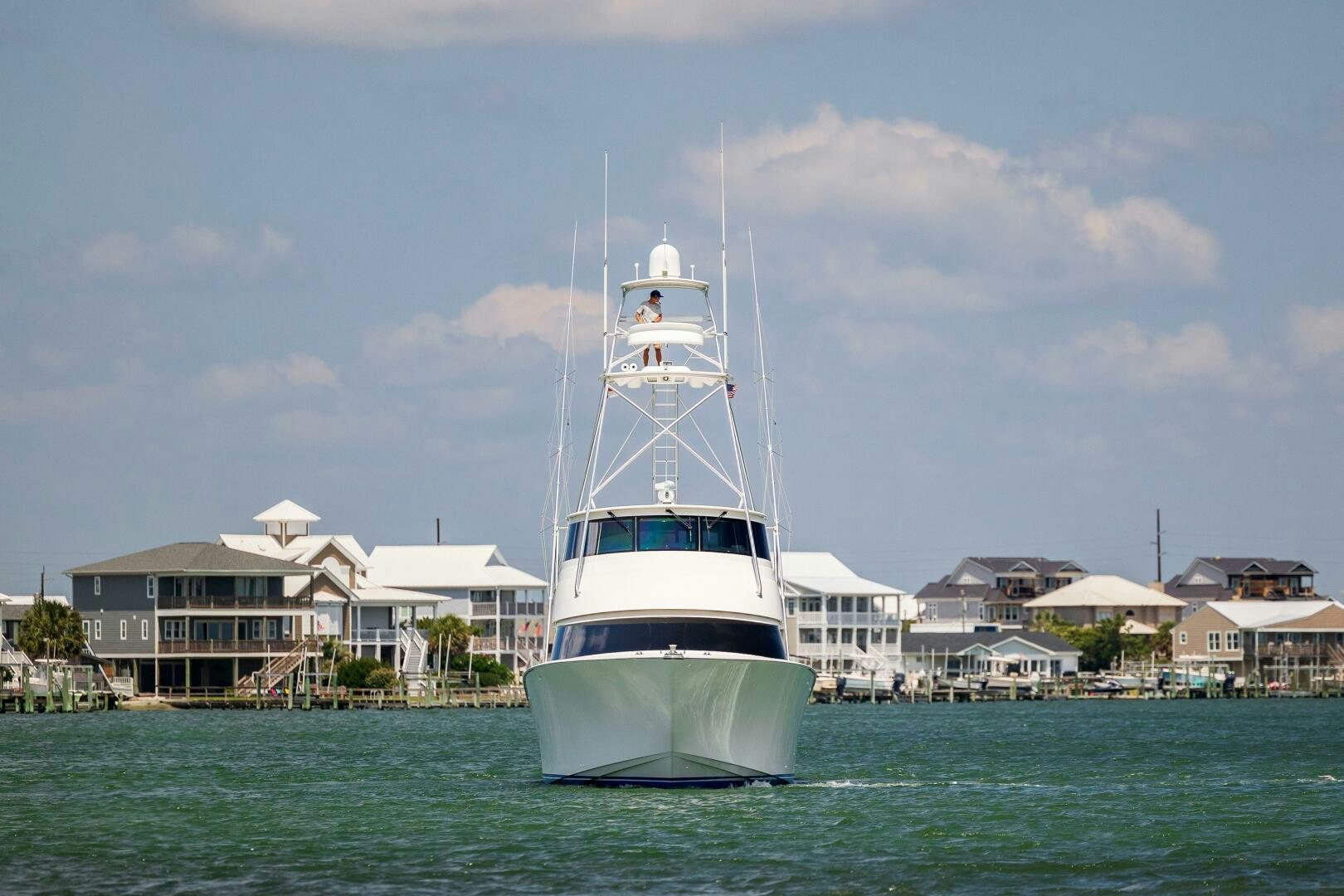 a white boat in the water aboard SAVING GRACE Yacht for Sale
