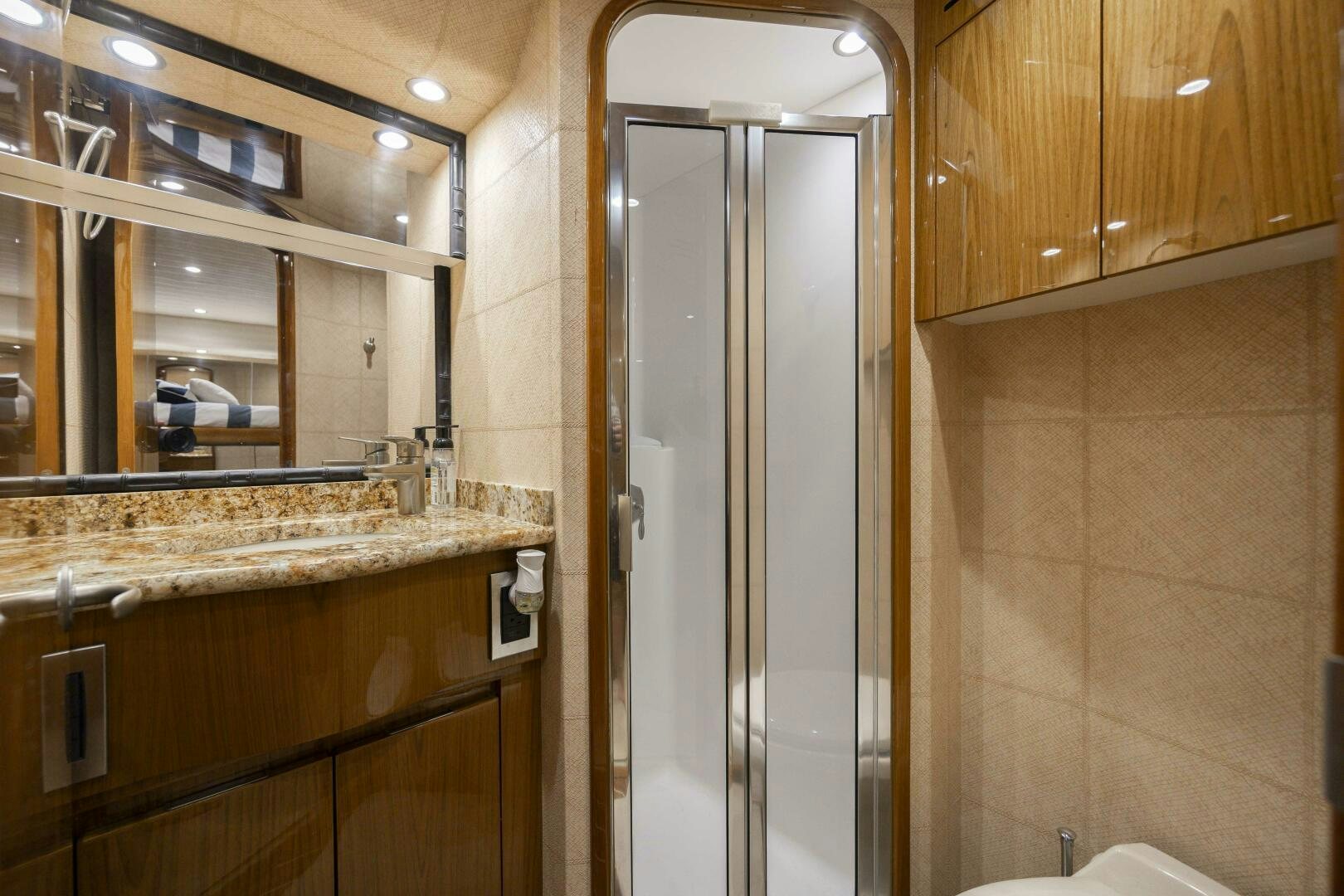 a bathroom with a glass shower aboard SAVING GRACE Yacht for Sale