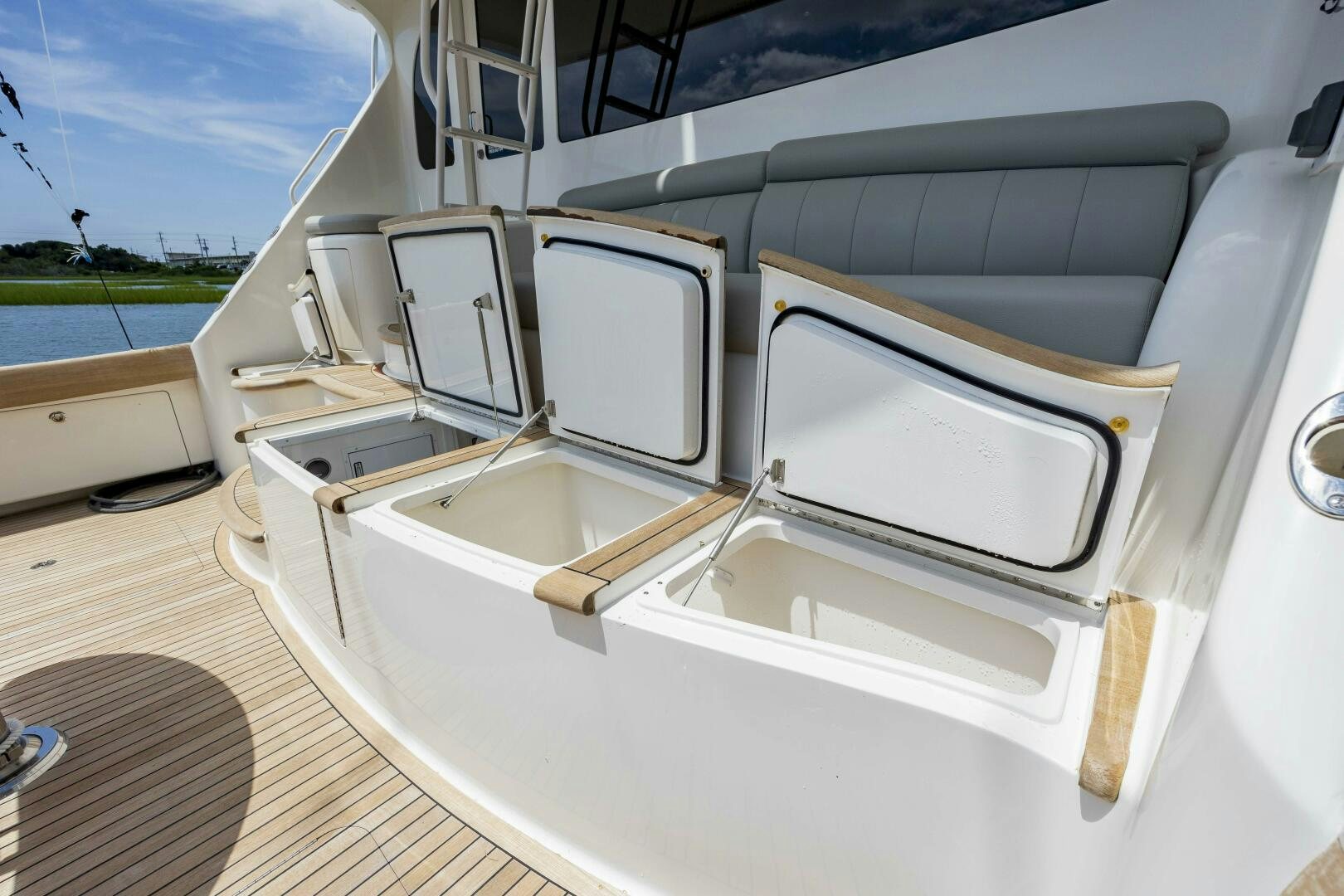 a white car with open doors aboard SAVING GRACE Yacht for Sale