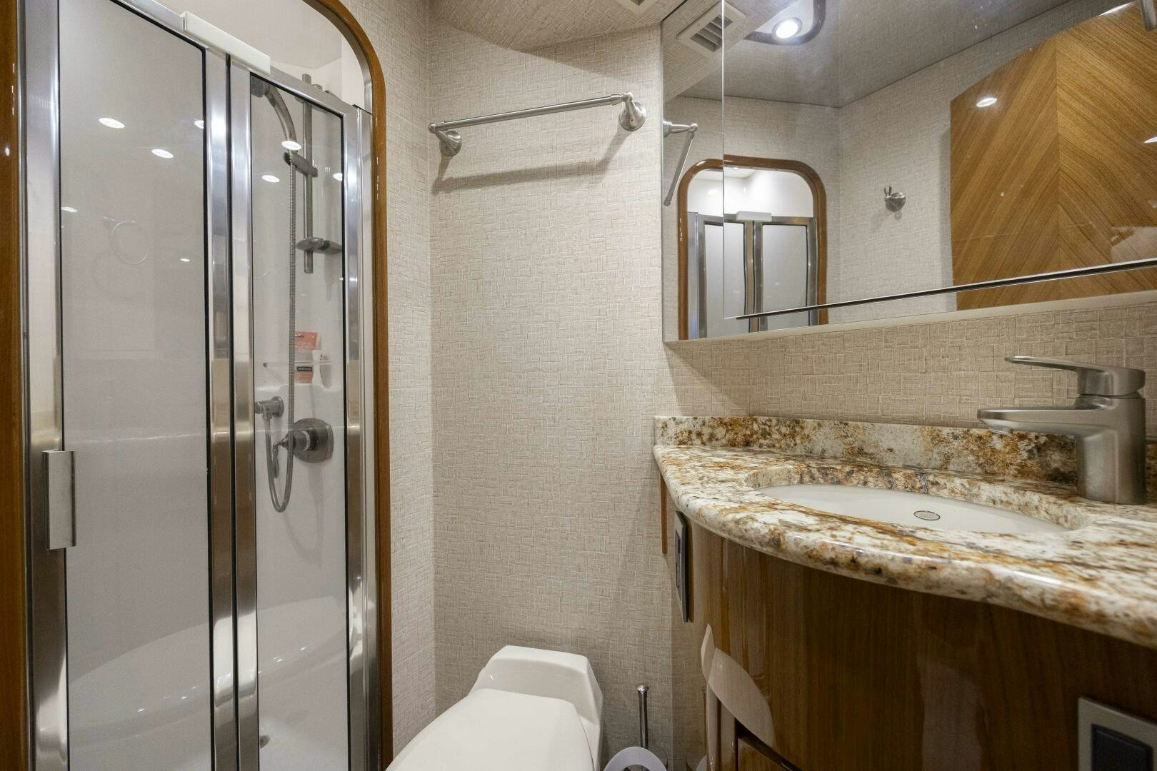 a bathroom with a glass shower aboard SAVING GRACE Yacht for Sale
