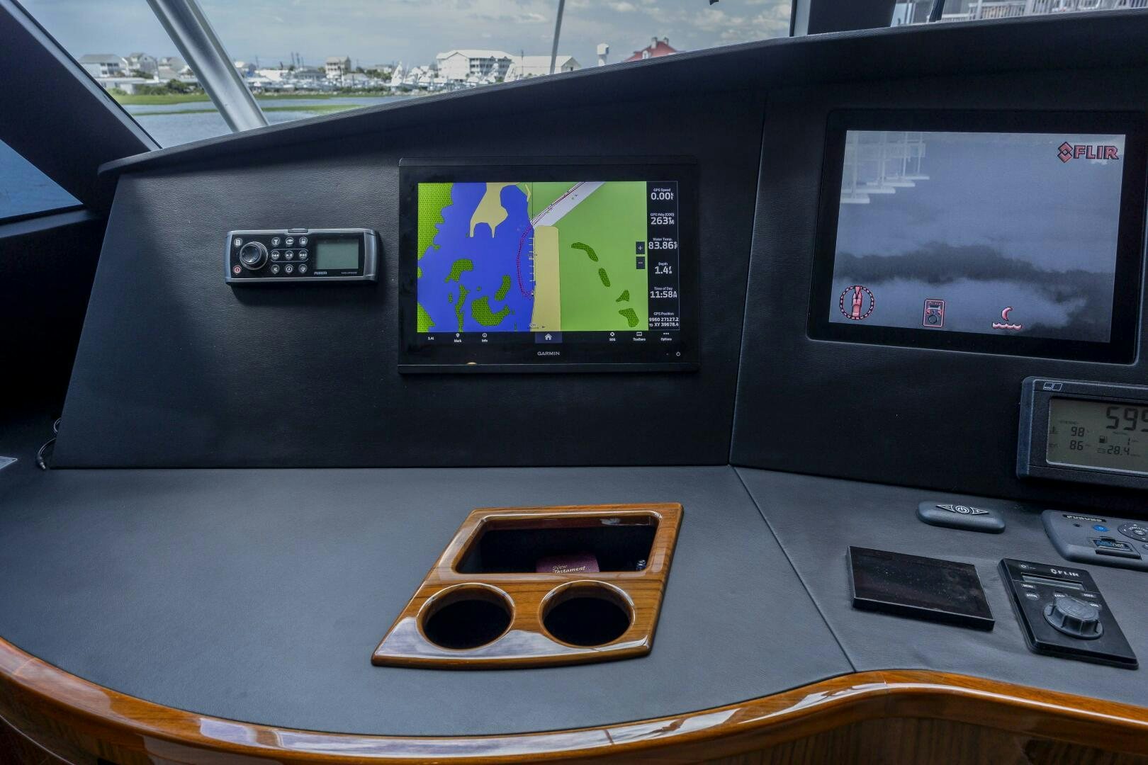 a black electronic device with a screen and a screen with a green screen aboard SAVING GRACE Yacht for Sale