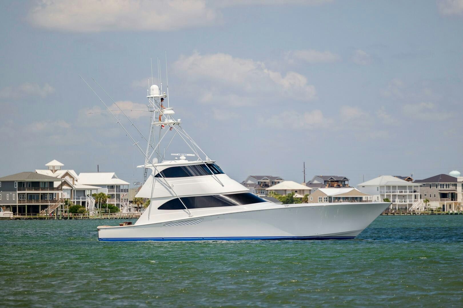 a white boat in the water aboard SAVING GRACE Yacht for Sale