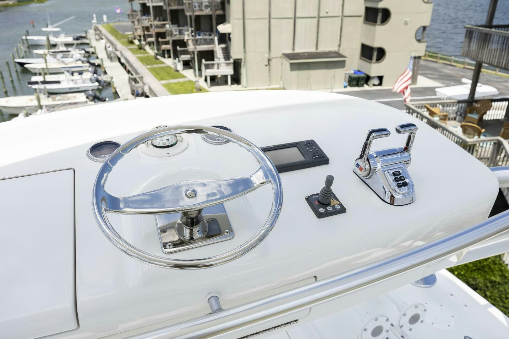 a white car parked on a rooftop aboard SAVING GRACE Yacht for Sale