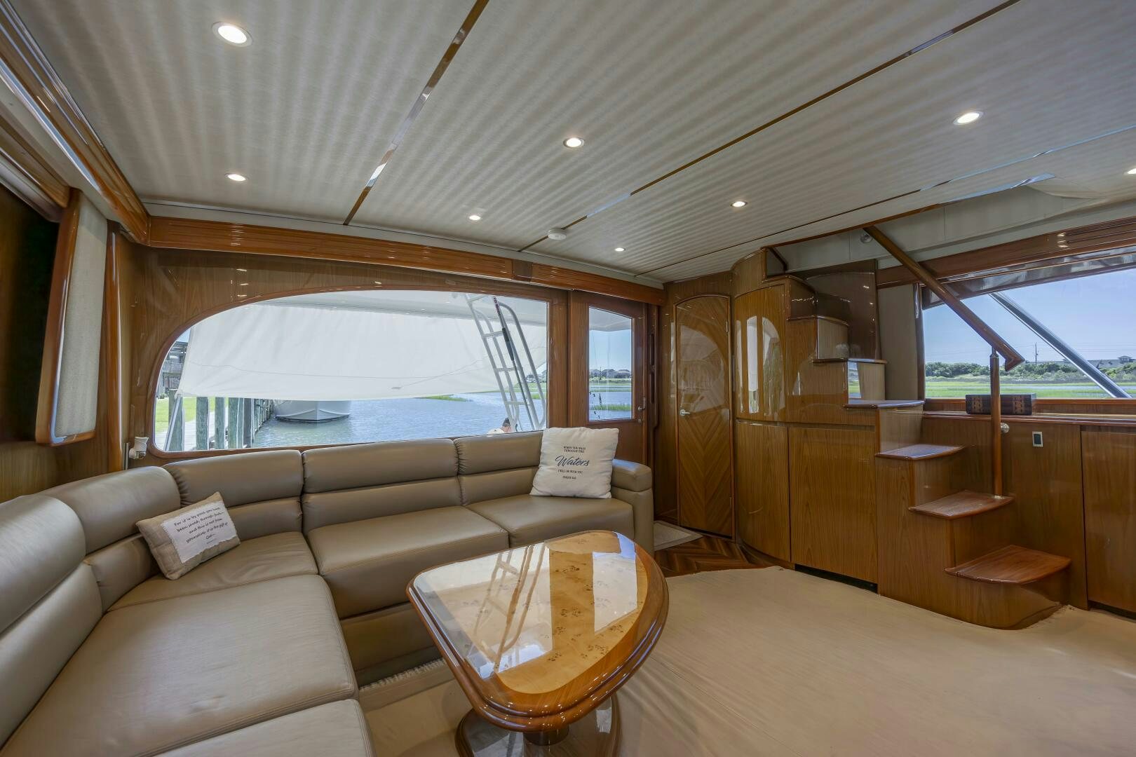 a living room with a couch and a table aboard SAVING GRACE Yacht for Sale